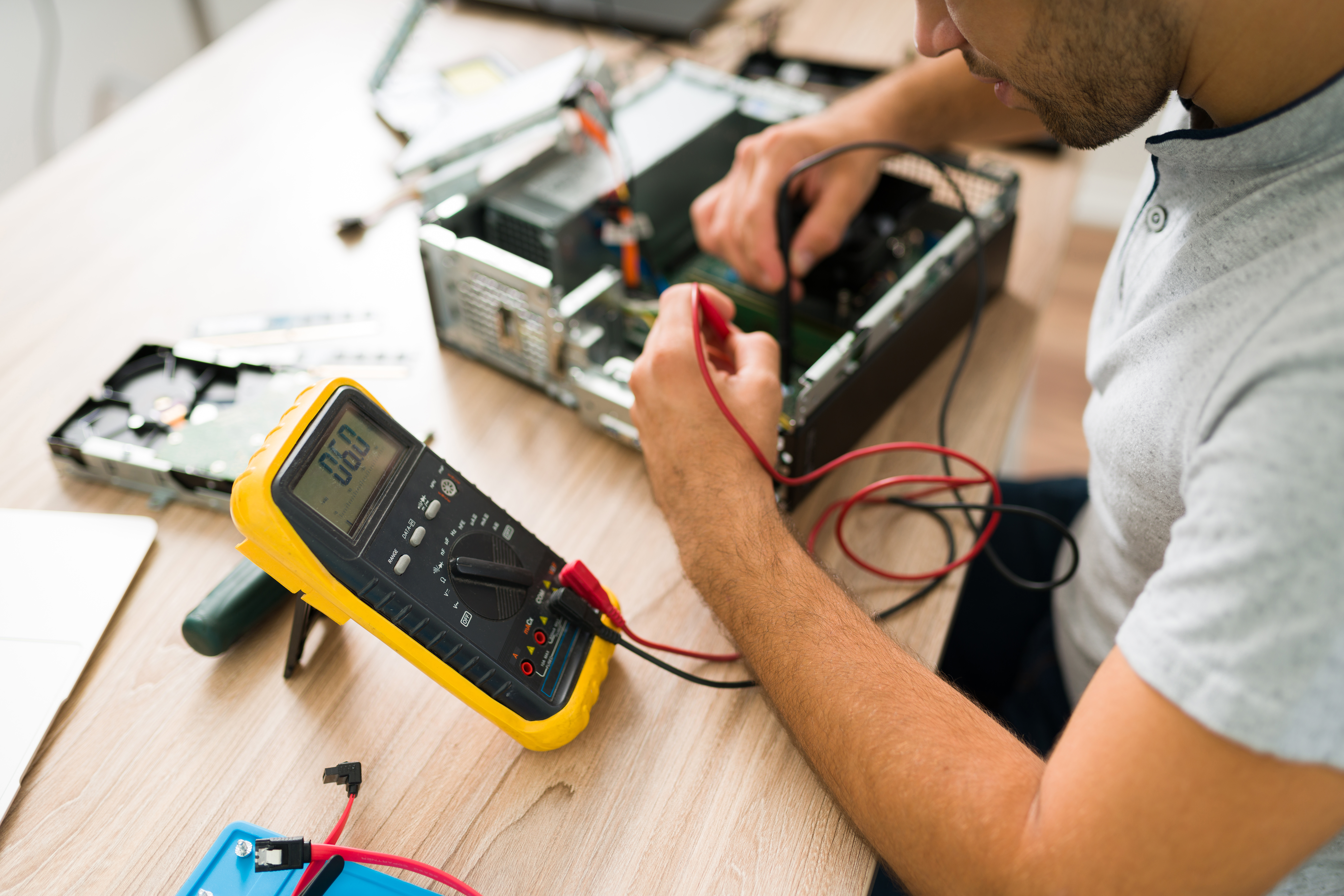 professional engineer connecting a multimeter to a pc crowborough